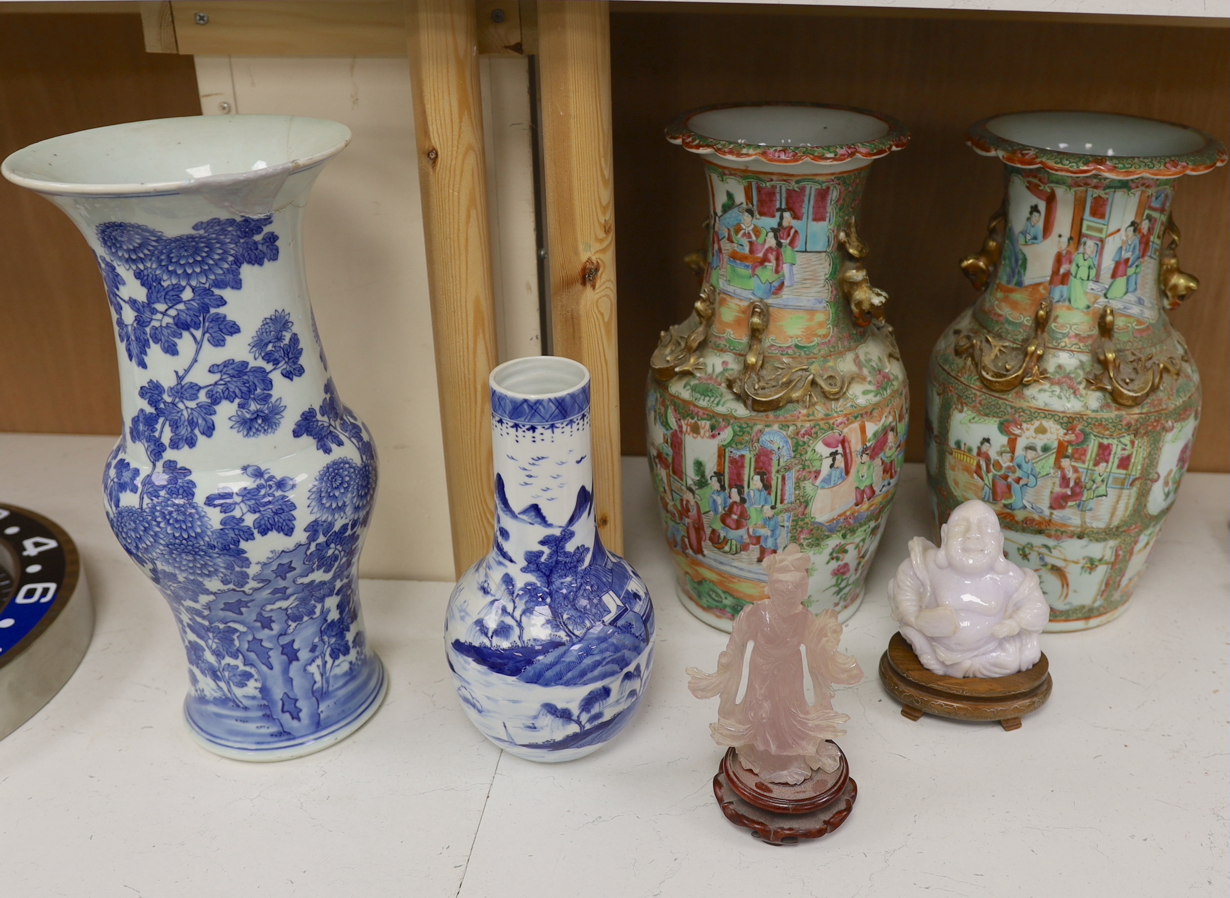 A pair of Chinese Canton decorated famille rose enamelled vases, 36cm high